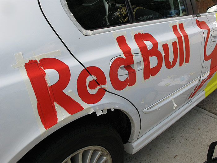 Red Bull text masked and painted